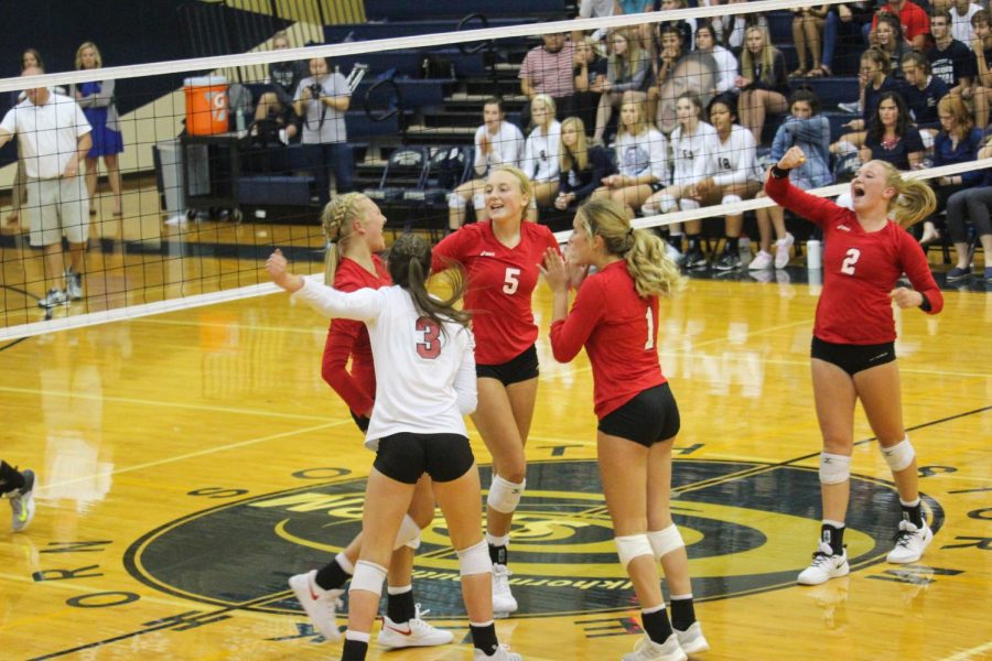 The Antlers celebrate winning a point against Elkhorn South. The Antlers lost to the Storm 3-0.