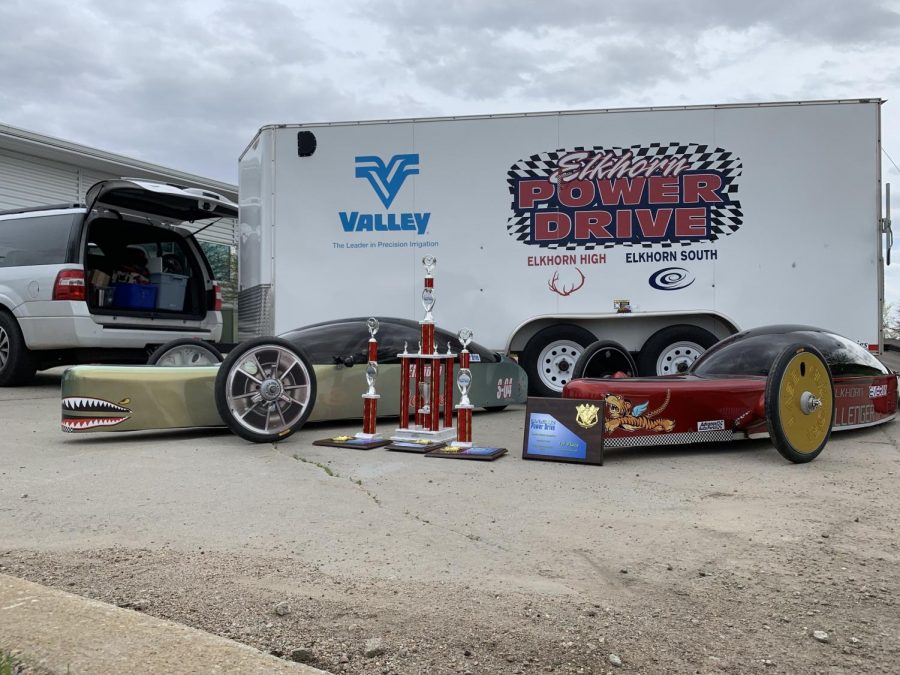 Elkhorn Power Drive displays their trophies and cars after winning a 4th consecutive state championship. The team designs, builds are races two electric vehicles.