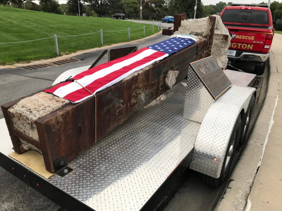 An American flag rests on top of a piece of the Northern tower that fell on September 11th, 2001. The piece was a support beam. 