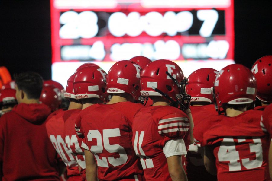 Elkhorn football players standing at the sidelines. 