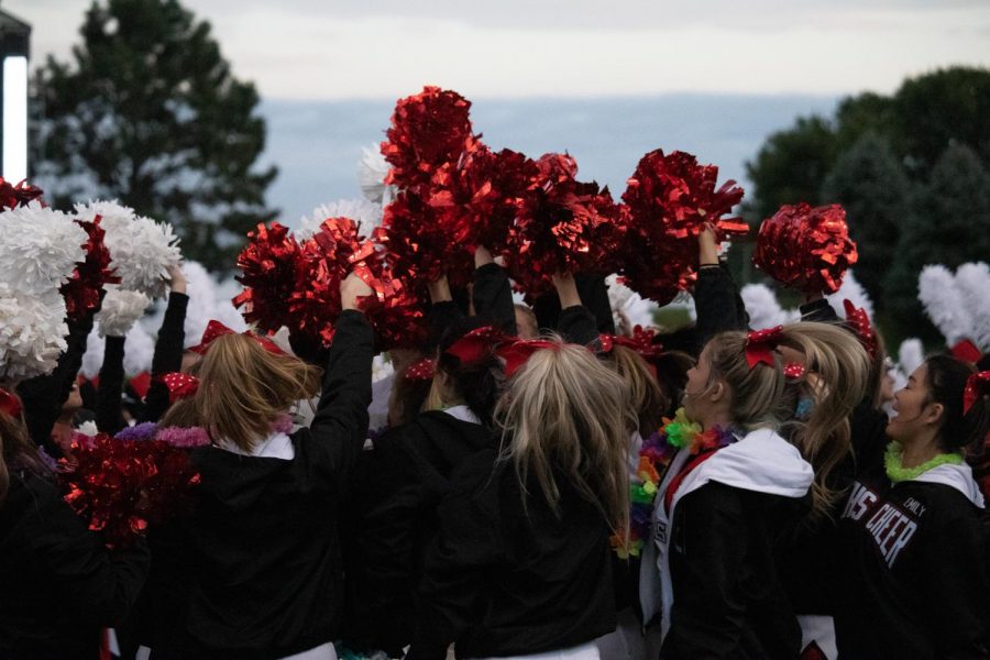 The Elkhorn Cheerleaders hype themselves up before cheering for the Antlers as they play the Bulldogs. 