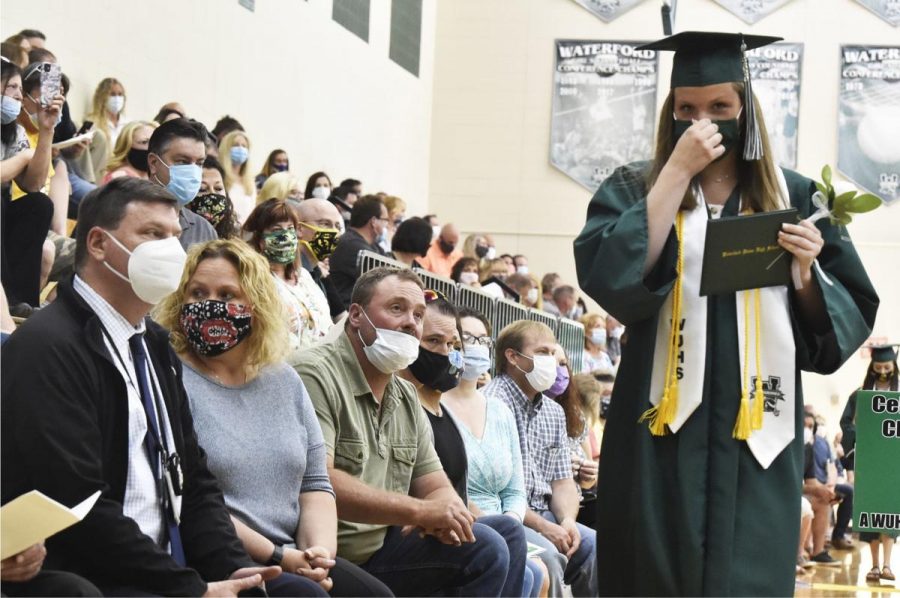 A high school in Connecticut holds an in-person graduation ceremony amdist a global pandemic.