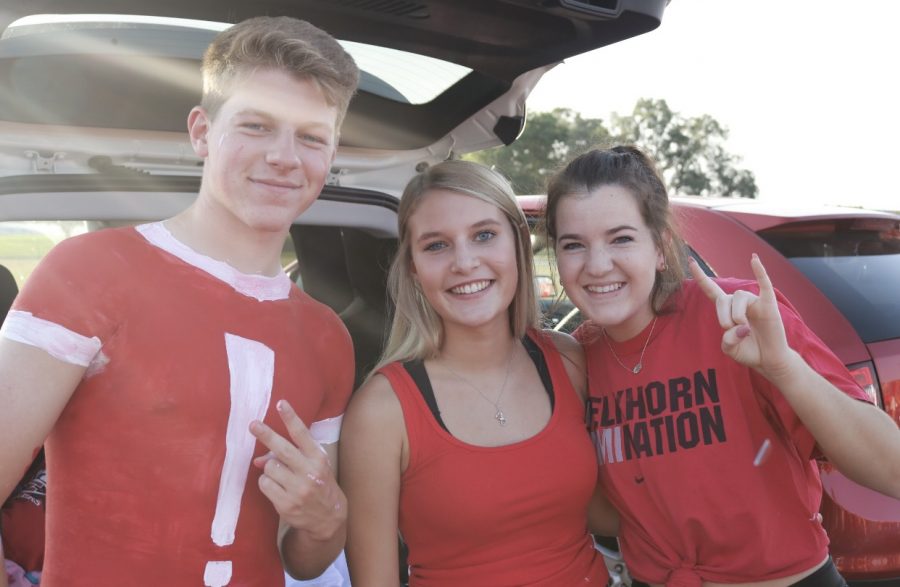 Seniors, Alex Brabec, Maxie Sutherland and Sophie Swartzendruber at tailgate waiting for the Red & White Scrimmage.