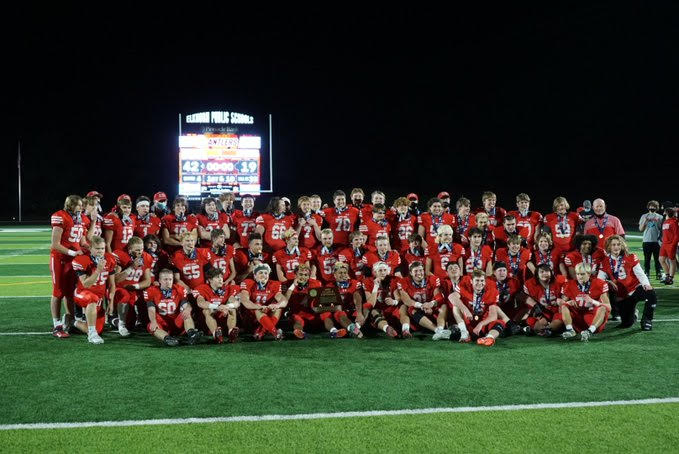The football team celebrates their state title with a team photo.