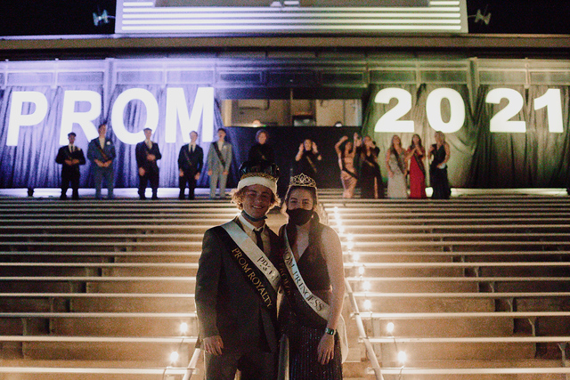 Juniors Hank Kroger and Victoria Bashara are crowned Prince and Princess at the prom coronation ceremony as the court looks on. Prom was held outdoors for the first time this year due to the pandemic.