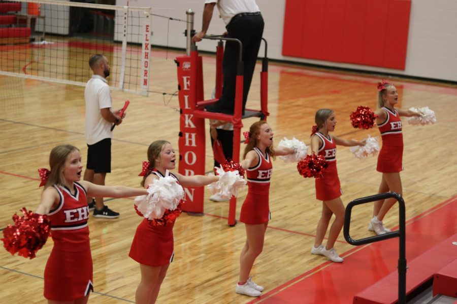 The Elkhorn Antlers cheer team cheering while the volleyball teams are having a timeout. 