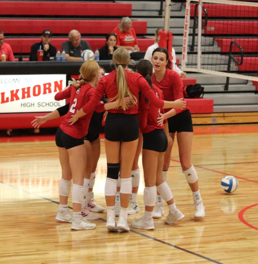 Elkhorn Volleyball supporting one another. 