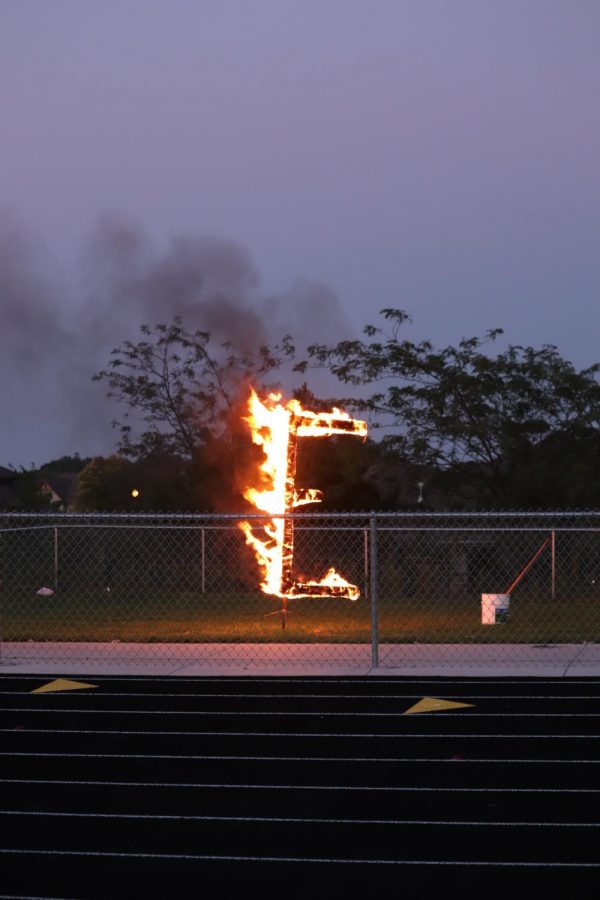 The E was burnt behind the fence this year. 