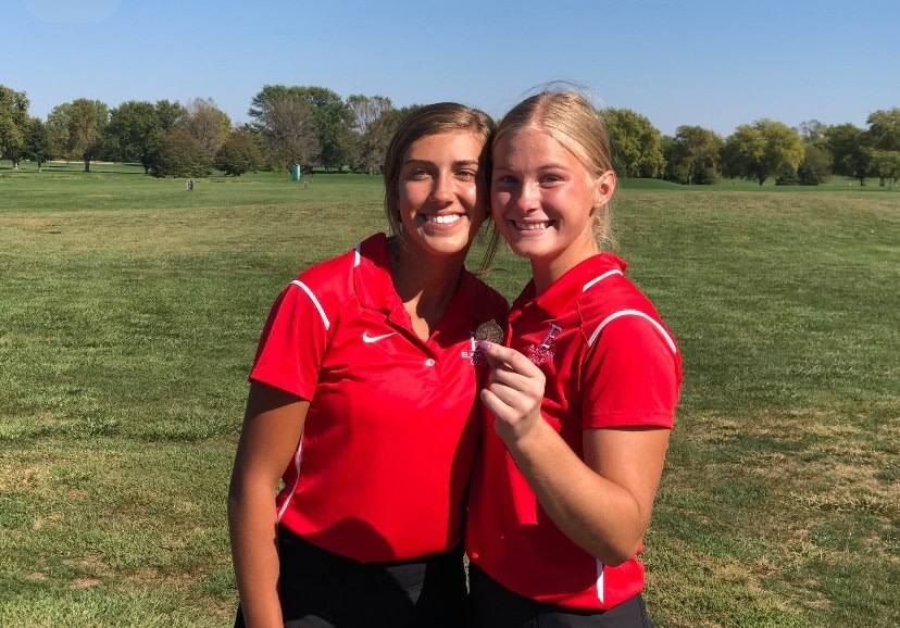 Katie Schultz (left) and Alexa Swerczek (right) celebrate playing at districts. 
