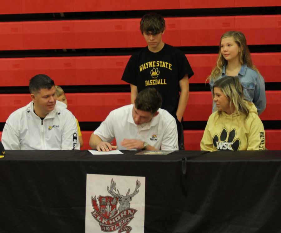 Senior Blake Stanley signs his letter of intent Nov. 10. Stanley will play baseball at Wayne State.
