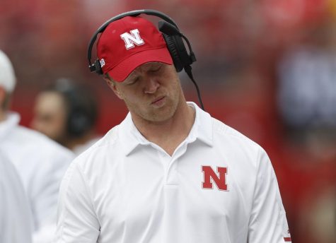 Nebraska Football Head Coach Scott Frost hangs his head in disappointment. In his first four seasons at Nebraska, Frost has compiled a record of 15-29. 