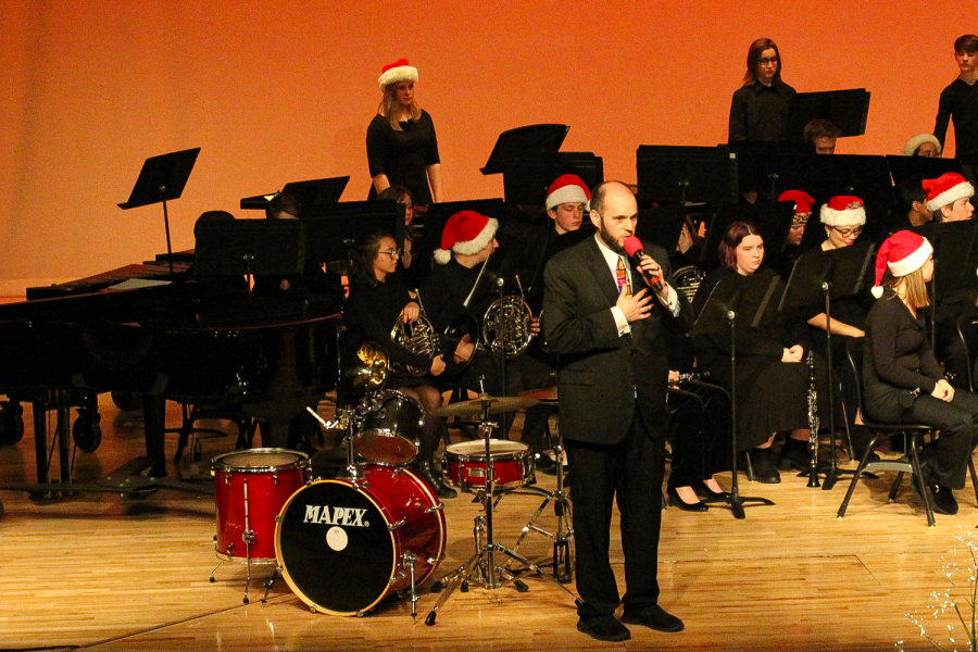 EHS Band director Kyle Dreesen calls for a moment of silence at the Winter Concert in remembrance of 