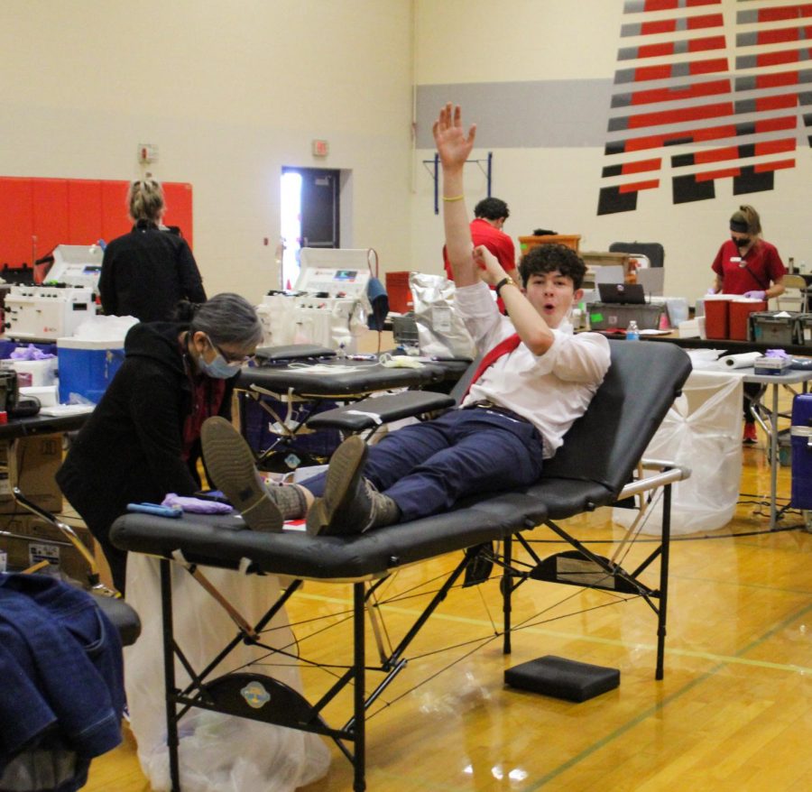 Senior Isaac Workman finishes donating blood for the annual Red Cross Blood Drive. 