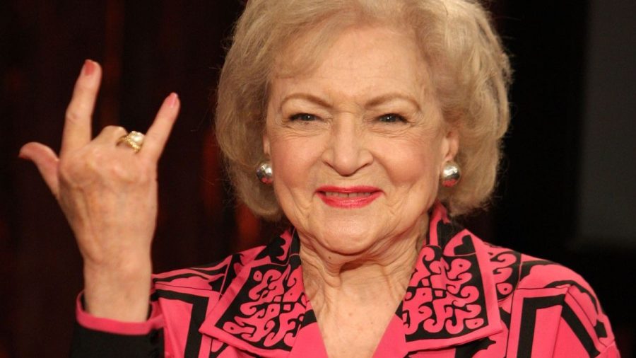Betty White throwing up a hand sign.
Courtesy of: WeGotThisCovered.com