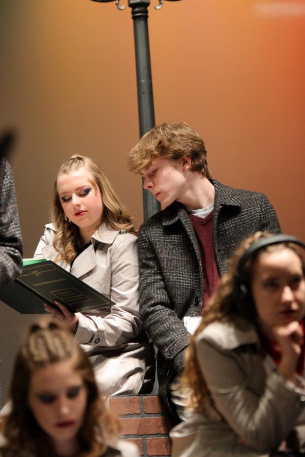 Shae Traynor and Hudson Goldal pretend to read a book together before the show starts.