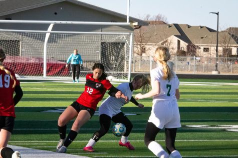 #12 Kennedy Meehan fighting for a loose ball. Antler Girls beat Columbus Scotus 2-1. Friday, March 25. 