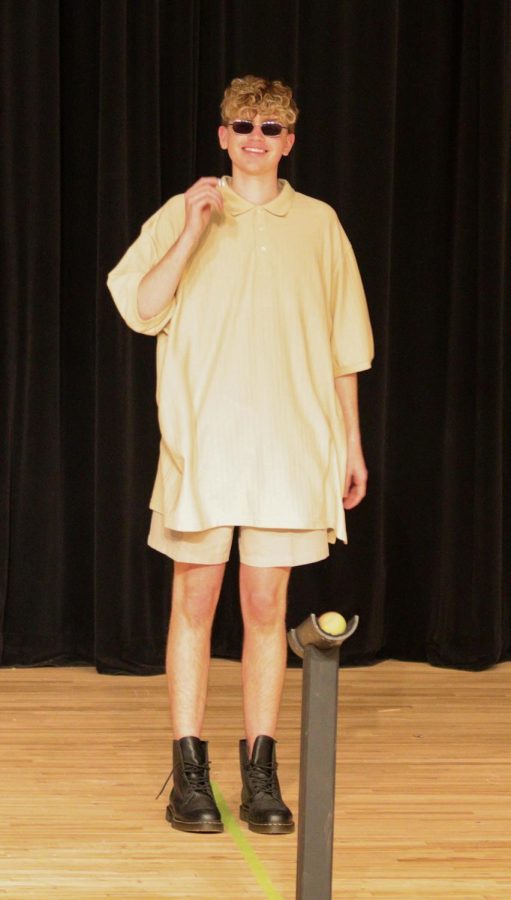 Max Langland stands on stage while showing off his handpicked outfit during the Mr.EHS pageant. 