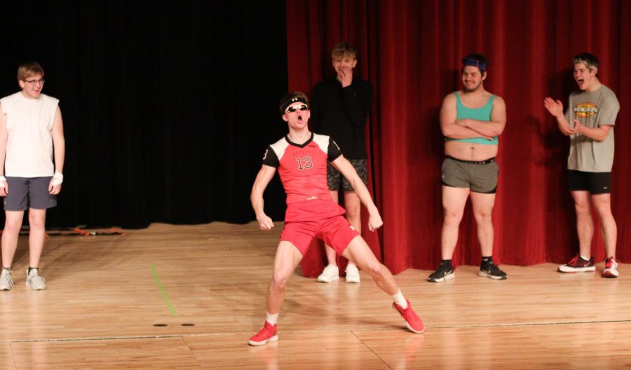 Dane Peterson enters on stage and screams at the audience. Peterson participates in the Mr.EHS pageant. 