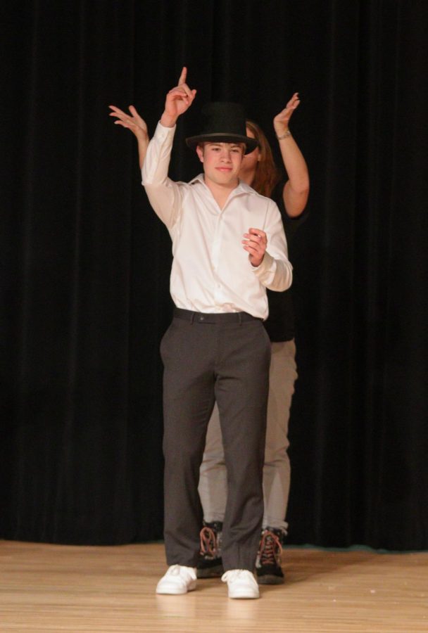 Zach Leinen is awarded a top hat and crowned Mr.EHS. He is crowned by Abby Whalen 