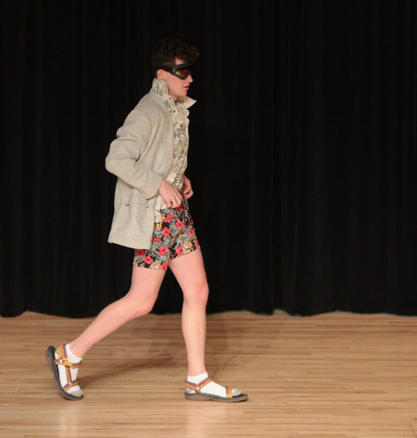 Isaac Workman walks on the stage during the fashion section of the Mr.EHS pageant. 
