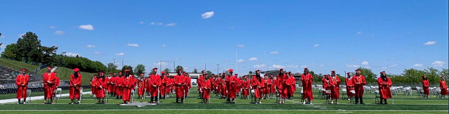 Members+of+the+EHS+class+of+2022+stand+and+prepare+to+move+their+tassle+to+commemorate+their+graduation.+The+ceremony+took+place+at+Elkhorn+stadium+May+22%2C+2022.
