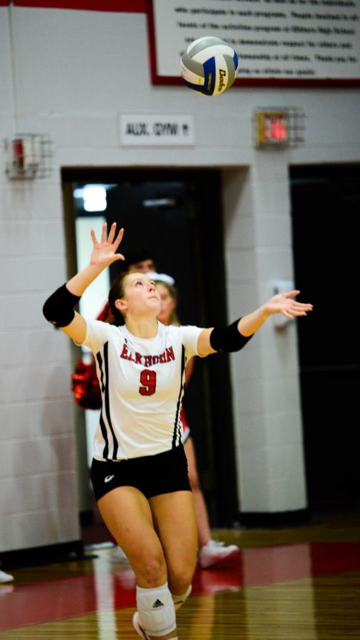 Senior Kaelyn Andersen performs an overhand serve during the EHS vs Omaha Mercy game. The Antlers won 3 games to 0. 