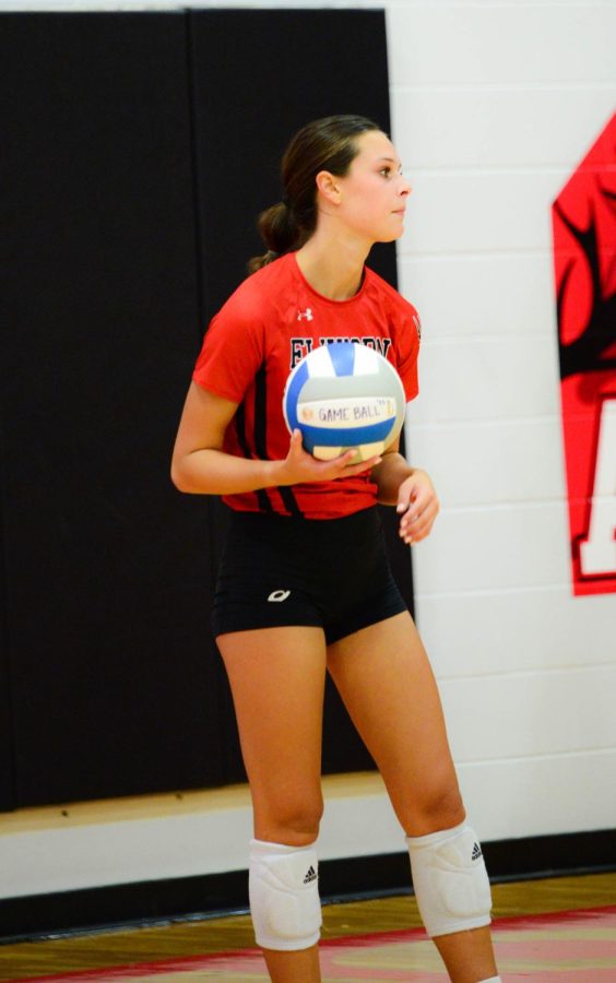 Senior Ella Schutte prepares to serve during the Antlers game against Omaha Mercy--shot 3. The Antlers won 3 sets to 0. 