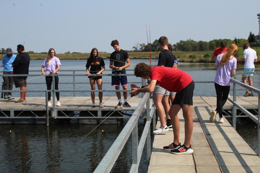 Lifestyle students patiently waiting for the fish to bite at their hooks.