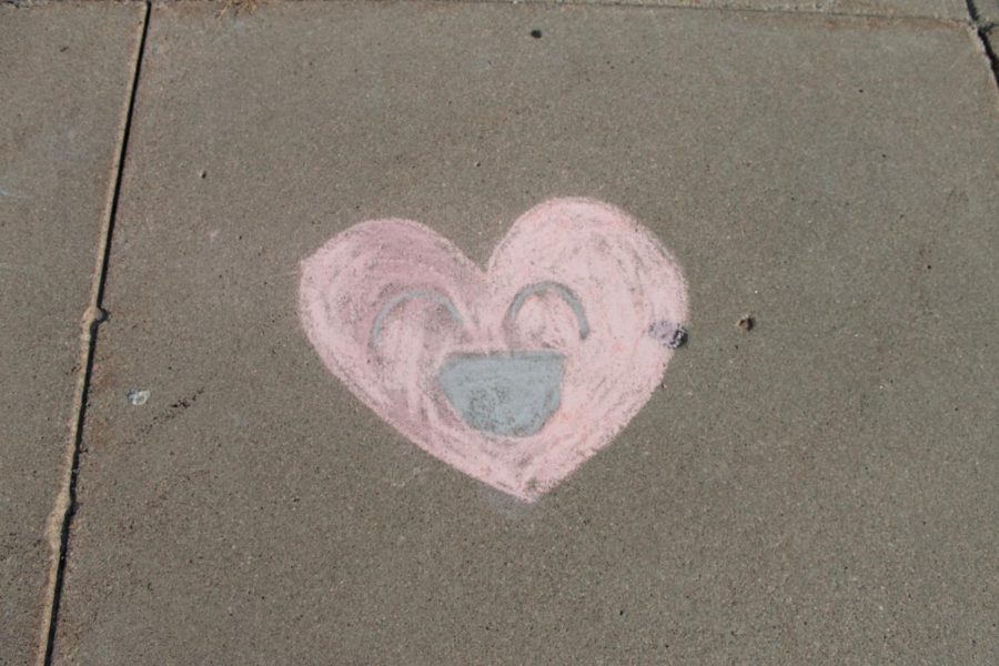 Chalk drawings in the entrance of Elkhorn High from the Chalk it Up event for suicide awareness week.