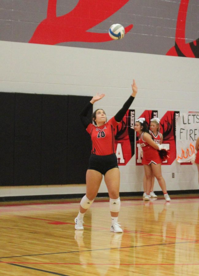 Senior Avery Hoegh serves in the 2nd set against Mercy.
