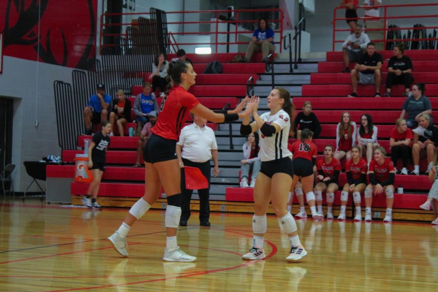 Senior captains, Haley Wolfe and Kaelyn Anderson, encourage each other in the second set.