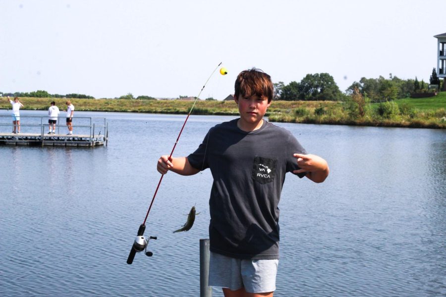 Judah Narber posing with the fish he caught on the Lifestyle Fishing Trip.