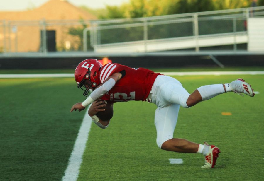 Senior KJ Schenck dives into the endzone to score a touchdown for Elkhorn. The Antlers beat the Titans 21-7 on Thursday, September 1st. 