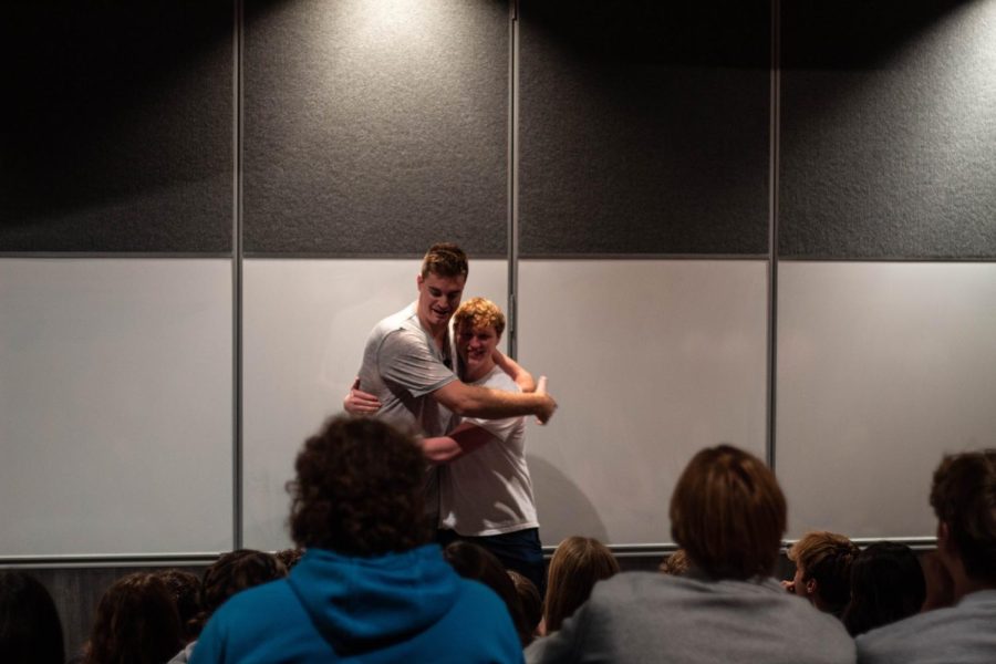 Kevin Atlas hugging Matt Uehling during his motivational speech.