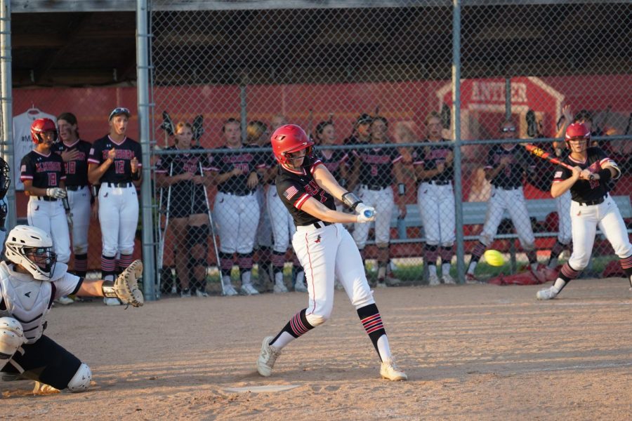 Number 27, Junior Makailey Beekman makes a hit.  Elkhorn won against Waverly 7-5 on 9/10.  Photo courtesy of Scott Avery.