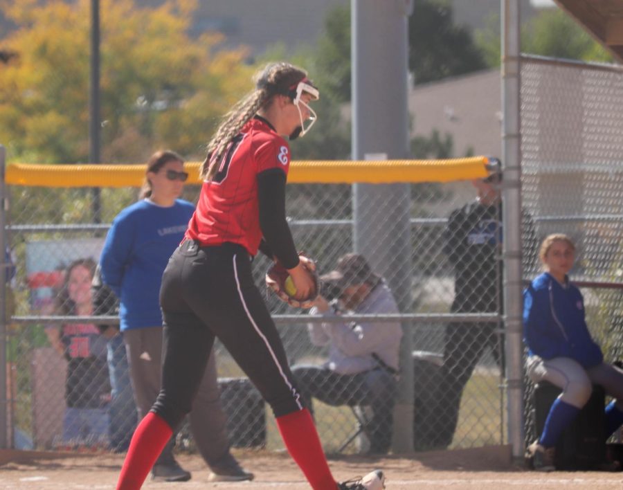 Nuismer pitches against her opponent trying to strike them out for an out.