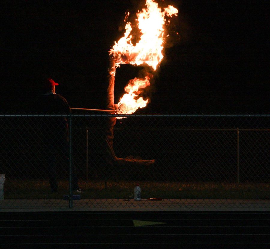 Mr. Schroeder lights the E on fire at the burning of the E.