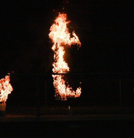 Mr. Schroeder lights the E on fire at the burning of the E.
