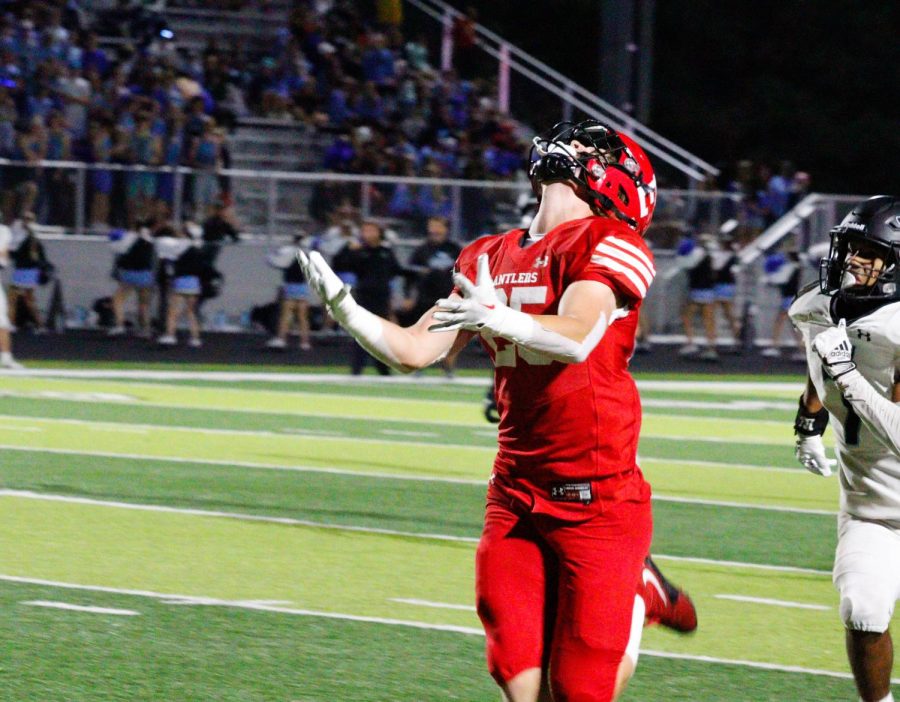 Senior Tanner Houck looks up to catch the ball. The Antlers beat the Wolves 49-35 on September 30th. 