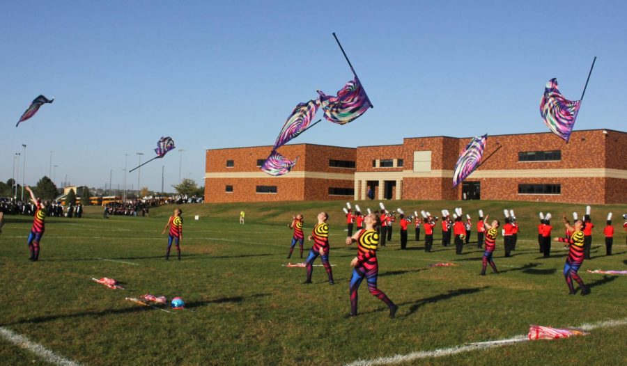 The Elkhorn colorguard warms up before the bands performance. 