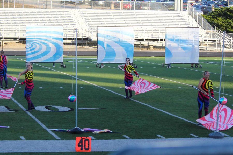 The Antler Colorguard spin their flags during the state marching band performance. 