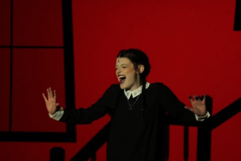 Senior Jocey Logue performs a solo in her role as Wednesday Addams.  Logue was cast as the third lead in the 2022 fall musical, The Addams Family.