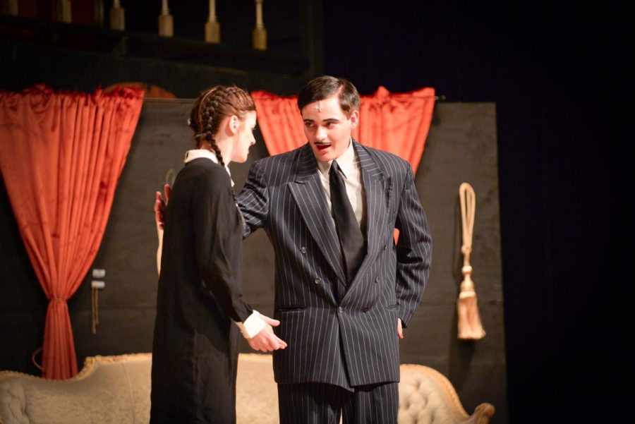 Jocey Logue (Sr), playing Wednesday Addams, confiding in Fischer Kirven (Sr), playing  Gomez Addams, during the Addams Family musical