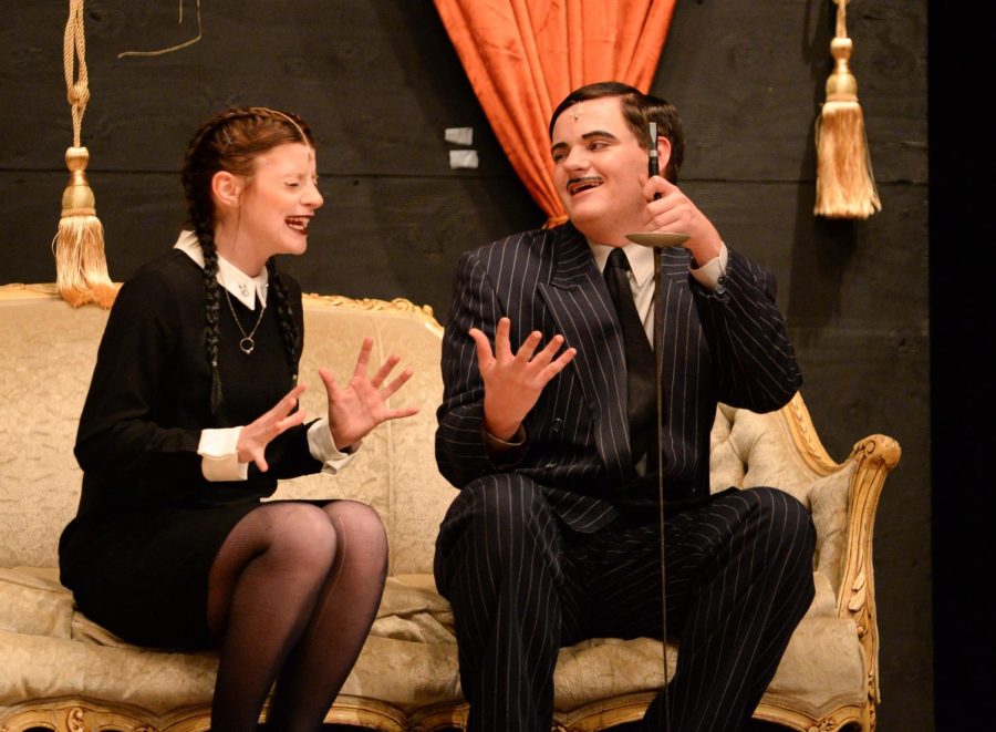 Fischer Kirven (Sr) and Jocey Logue (Sr), playing Gomez and Wednesday Addams respectively, talking to each other during the dress rehearsal of the Addams Family musical