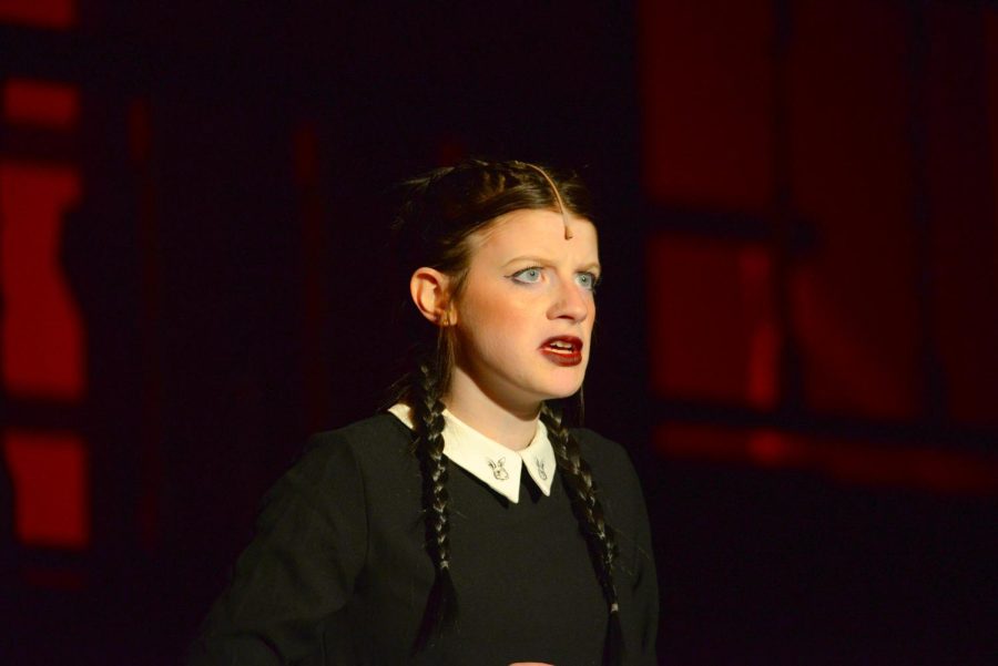 Jocey Logue (Sr) gazing angrily upon the audience as Wednesday Addams during the dress rehearsal of the Addams Family musical