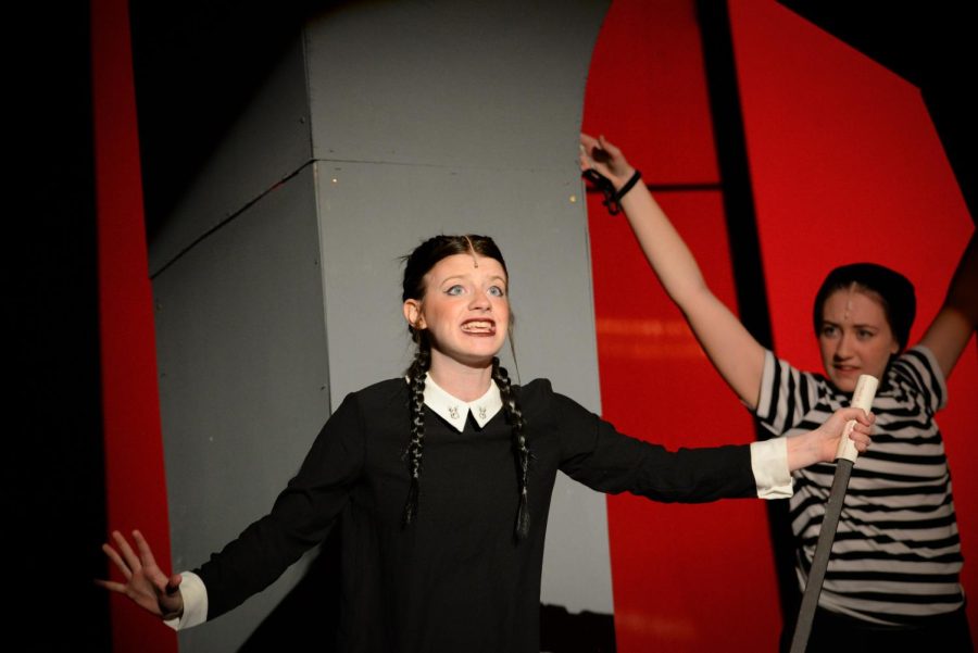 Jocey Logue (Sr), playing Wednesday Addams, performing during the song Pulled as she tortures Pugsley Addams (McKenzie Carlson (Jr))