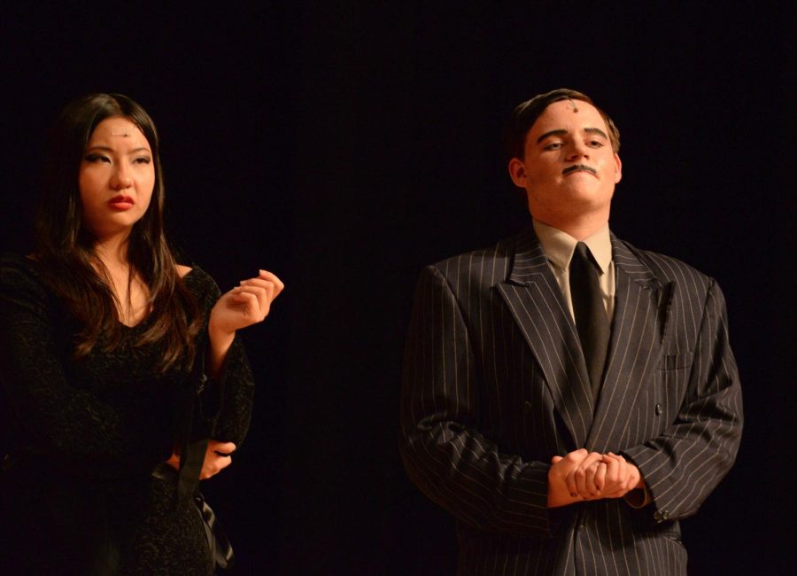 Fischer Kirven (Sr) and Marielle Cruz (Jr), performing as Gomez and Morticia Addams respectively, looking towards the audience disgustedly during the song One Normal Night of the Addams Family musical
