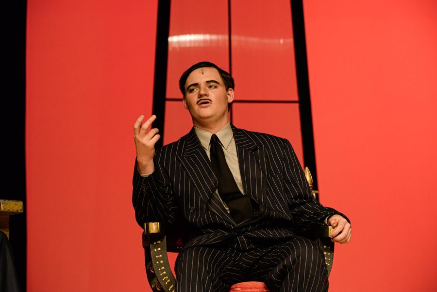 Fischer Kirven (Sr) sitting in an antique chair during the dress rehearsal of the Addams Family musical