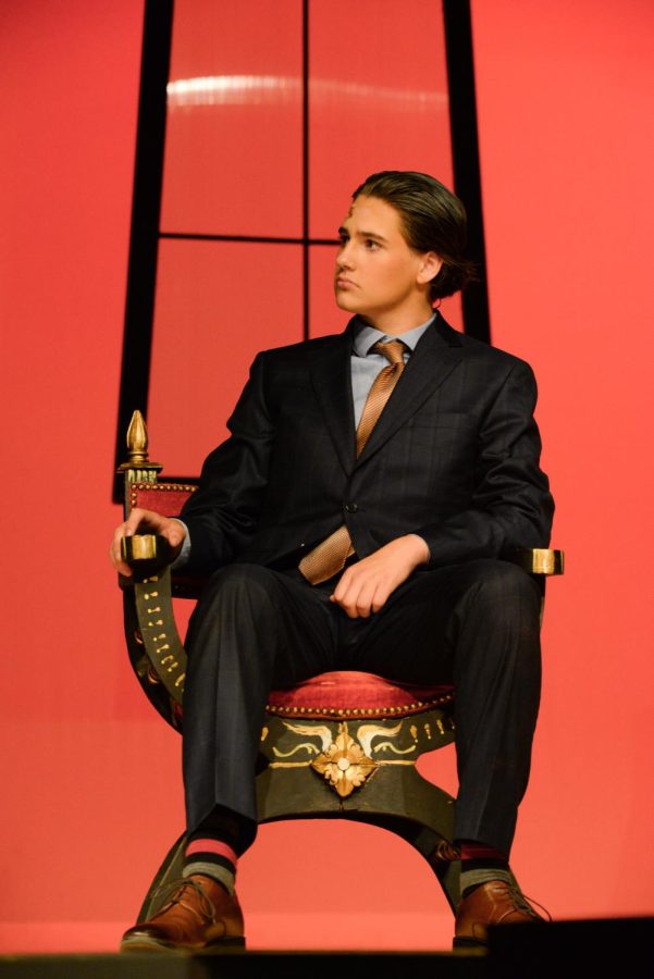 Noah Lindberg (Sr) sitting in an antique chair during the dress rehearsal of the Addams Family musical