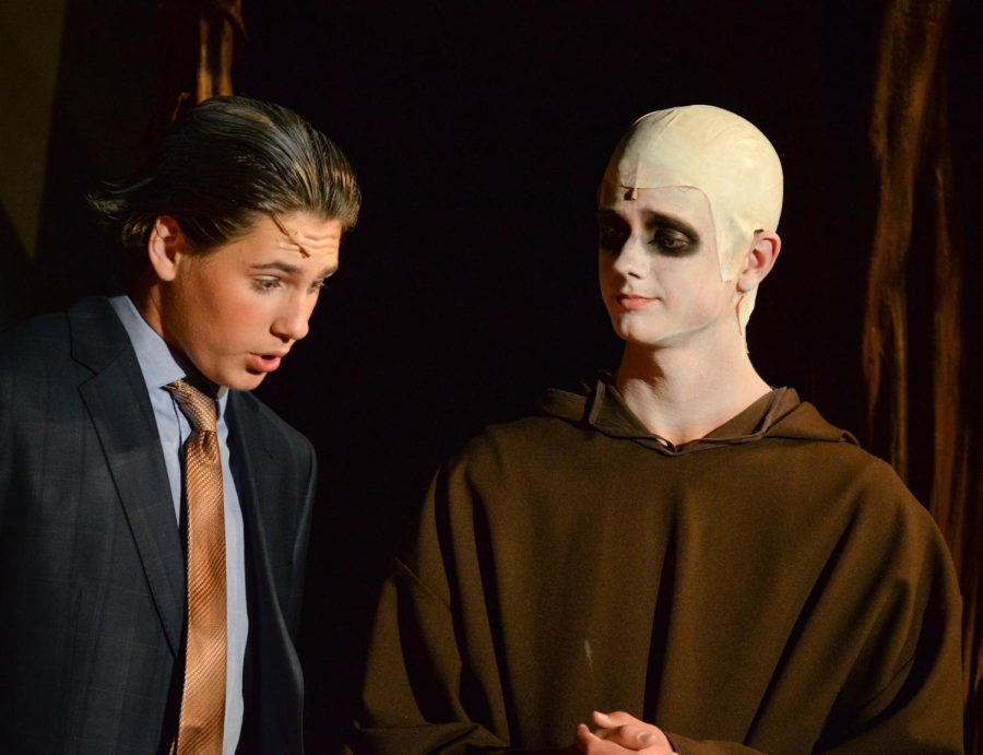 Noah Lindberg (Sr) and Logan Kieckhafer (Jr) conferring during the second act of the Addams Family musical